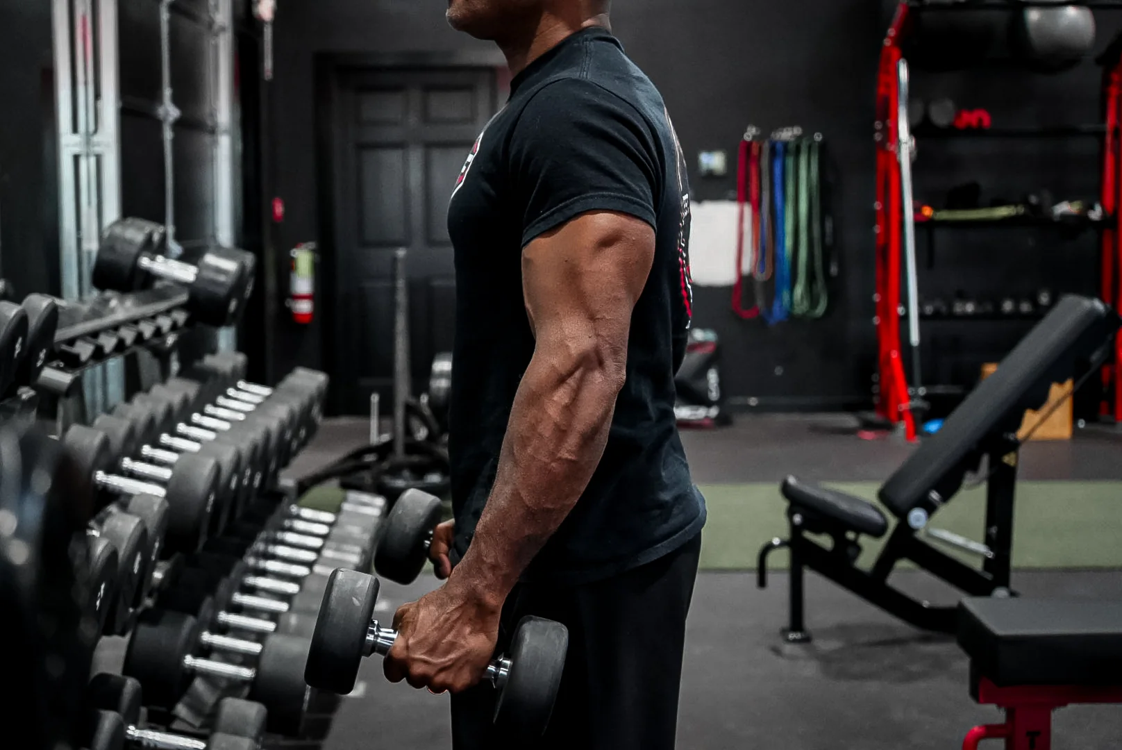 Craft Fitness member training with dumbbells